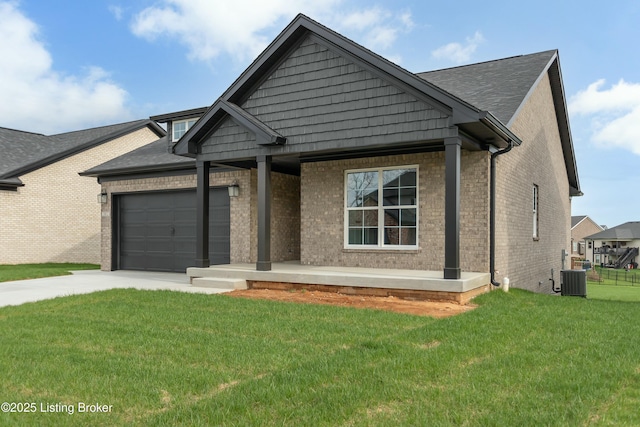 382 Williamsburg Dr, Mt Washington, KY 40047 - view of front of house with a front lawn, a porch, concrete driveway, a garage, and brick siding