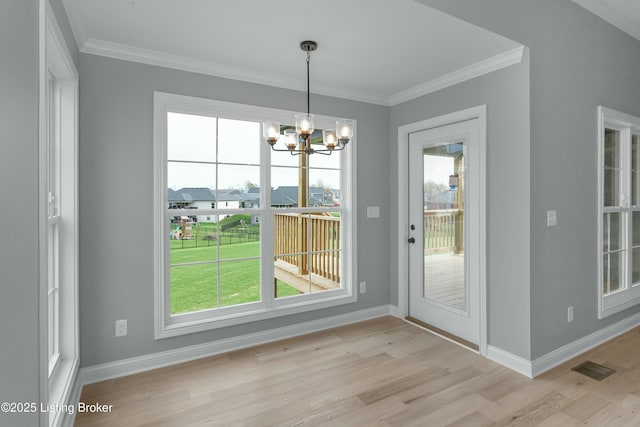 382 Williamsburg Dr, Mt Washington, KY 40047 - unfurnished dining area featuring light wood-style floors, baseboards, a wealth of natural light, and a notable chandelier