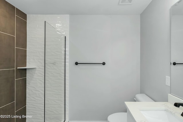 382 Williamsburg Dr, Mt Washington, KY 40047 - bathroom with visible vents, a tile shower, vanity, and toilet