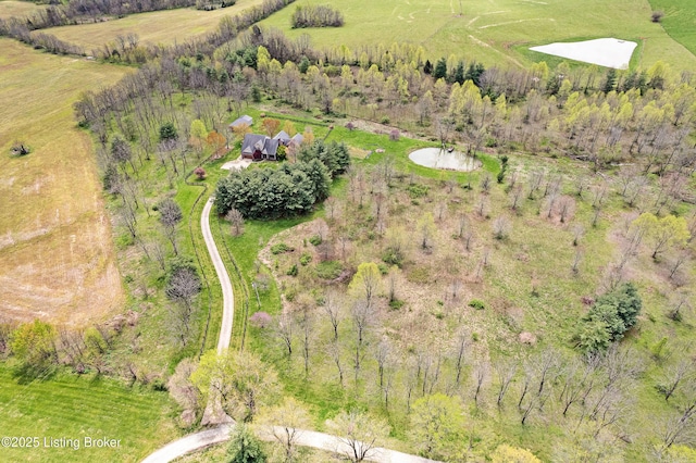 birds eye view of property with a rural view