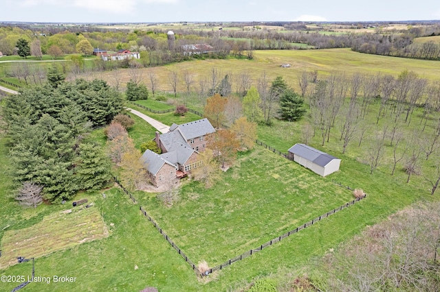 birds eye view of property with a rural view