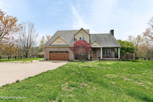 view of front of property featuring fence, a front lawn, driveway, a porch, and brick siding