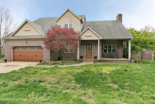 view of front of house featuring a front lawn, brick siding, and a garage