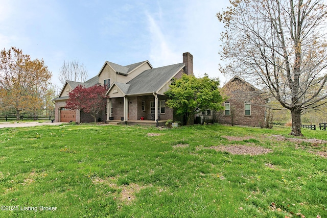 view of front of property with covered porch, fence, brick siding, an attached garage, and a front yard