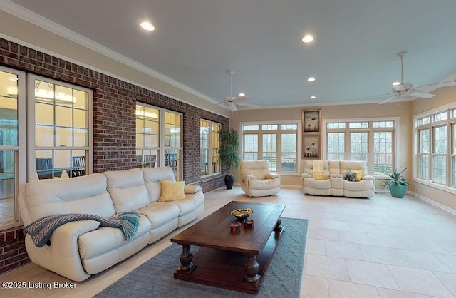 living room featuring baseboards, a ceiling fan, and recessed lighting