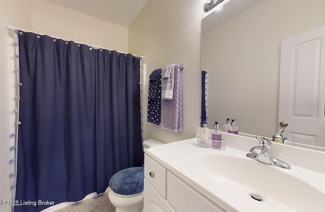 full bath featuring tile patterned flooring, toilet, vanity, and curtained shower