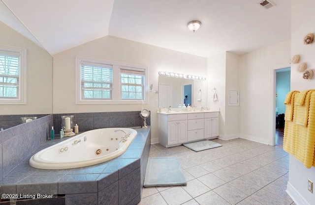 full bathroom with plenty of natural light, visible vents, a whirlpool tub, and tile patterned floors