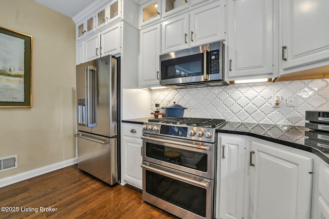 4232 Ashleywood Ct, Louisville, KY 40241 - kitchen featuring visible vents, dark wood-style flooring, white cabinetry, stainless steel appliances, and backsplash