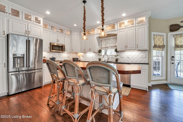 4232 Ashleywood Ct, Louisville, KY 40241 - kitchen with white cabinets, dark wood-style flooring, and appliances with stainless steel finishes