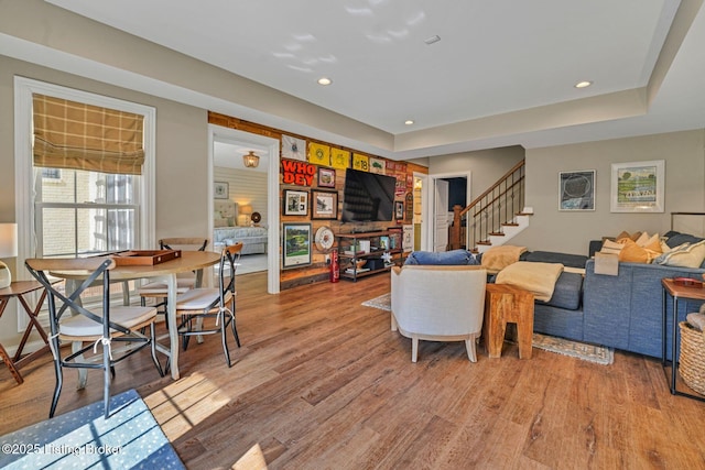 4232 Ashleywood Ct, Louisville, KY 40241 - living room with recessed lighting, stairs, a tray ceiling, and light wood-type flooring
