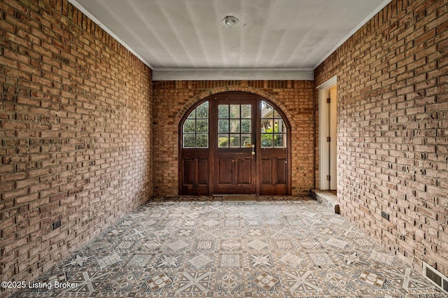 view of exterior entry with visible vents