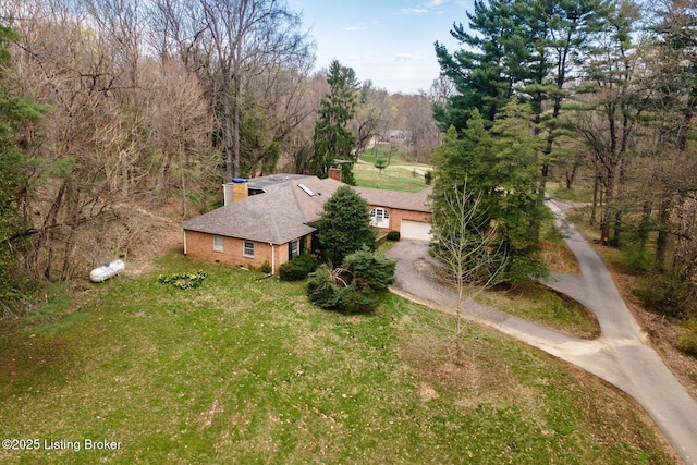 bird's eye view featuring a forest view