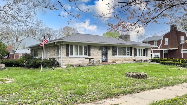 901 S 47th St, Louisville, KY 40211 - view of front facade with stone siding, a front lawn, a chimney, and a fire pit