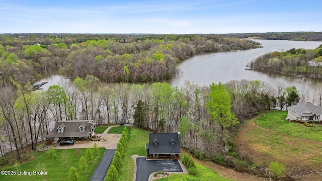 aerial view featuring a water view and a wooded view