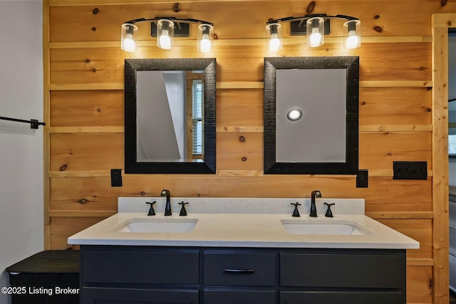 bathroom with double vanity and a sink