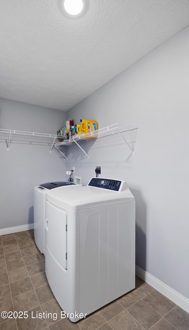laundry room featuring tile patterned floors, independent washer and dryer, laundry area, and baseboards