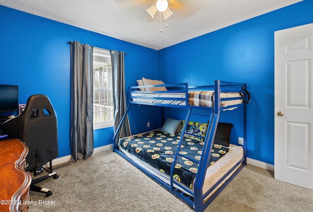 bedroom featuring baseboards, a ceiling fan, and carpet