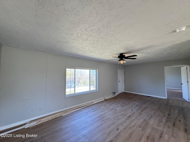 490 Blackjack Rd, Radcliff, KY 40160 - unfurnished room featuring a textured ceiling, wood finished floors, ceiling fan, and baseboards