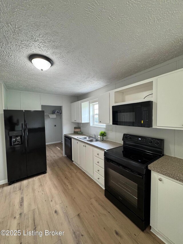 490 Blackjack Rd, Radcliff, KY 40160 - kitchen featuring black appliances, a sink, white cabinets, light wood finished floors, and a textured ceiling