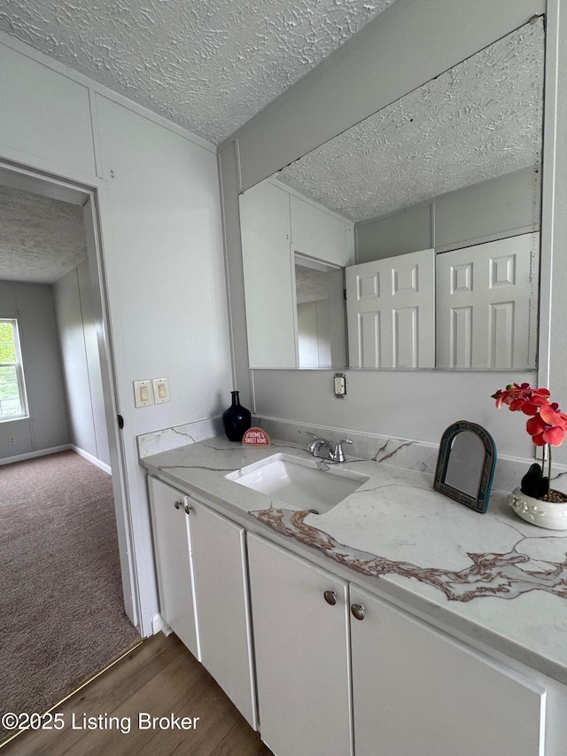 490 Blackjack Rd, Radcliff, KY 40160 - bathroom with a textured ceiling, wood finished floors, and vanity