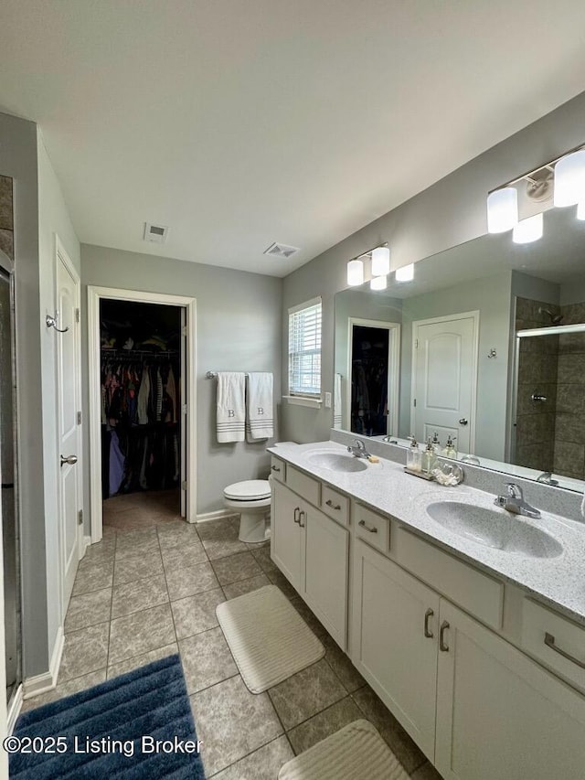 117 Richwood Cir, Georgetown, KY 40324 - bathroom with a stall shower, tile patterned floors, a spacious closet, and double vanity