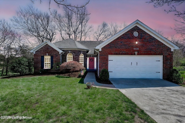 view of front of house featuring concrete driveway, a front yard, brick siding, and an attached garage