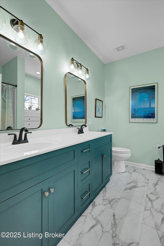 full bathroom featuring visible vents, a sink, toilet, double vanity, and marble finish floor