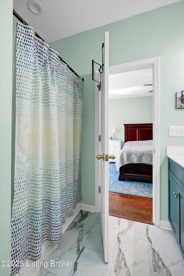 full bathroom with ensuite bath, vanity, marble finish floor, and a shower with curtain