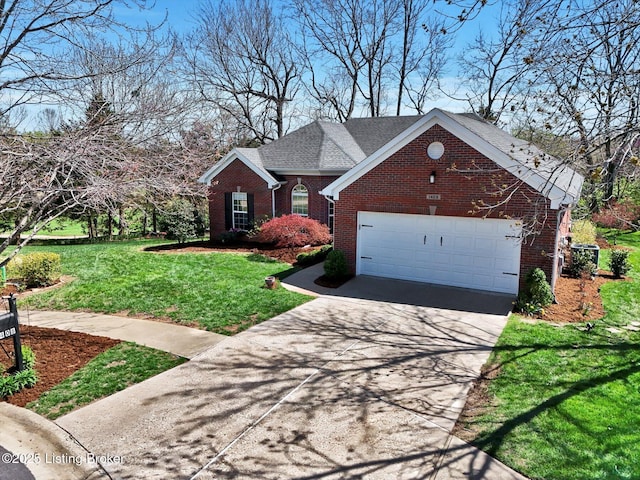 traditional-style house with an attached garage, concrete driveway, a front lawn, and brick siding