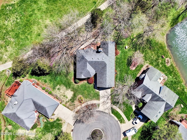 birds eye view of property featuring a water view