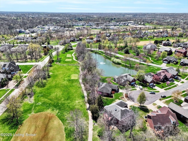 drone / aerial view with a water view and a residential view