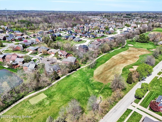 drone / aerial view with golf course view and a residential view