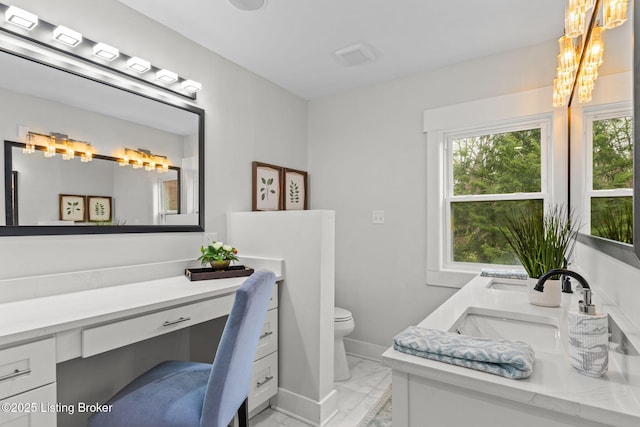 full bathroom with plenty of natural light, marble finish floor, double vanity, and toilet