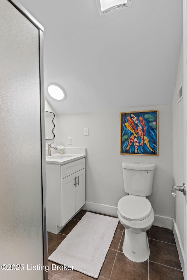 bathroom featuring toilet, visible vents, baseboards, and vanity