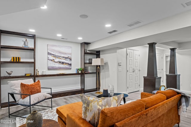 living room featuring visible vents, recessed lighting, and wood finished floors