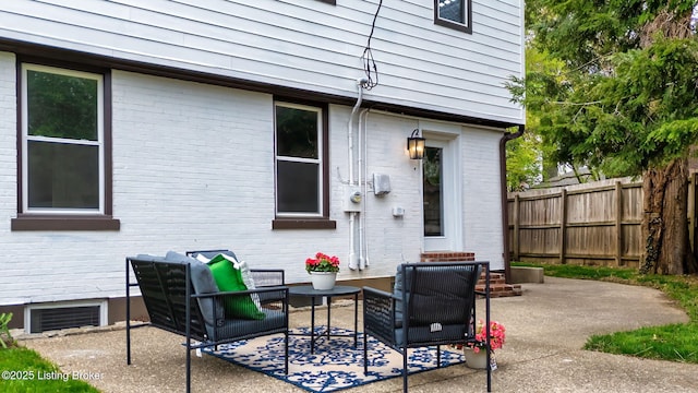 view of patio / terrace with fence and visible vents