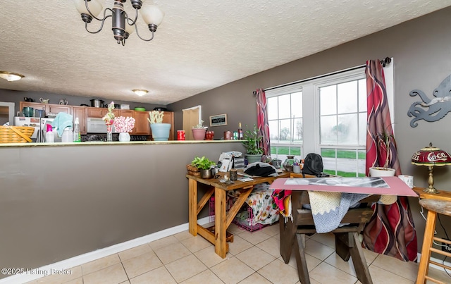 310 Wentworth Ave, Bedford, KY 40006 - dining room with a chandelier, light tile patterned floors, and a textured ceiling