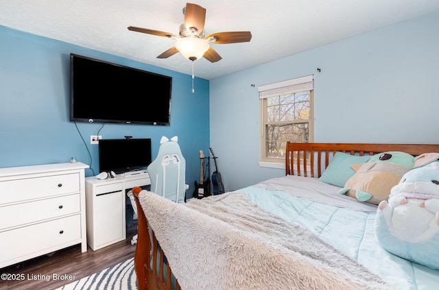 bedroom with dark wood-style flooring and ceiling fan