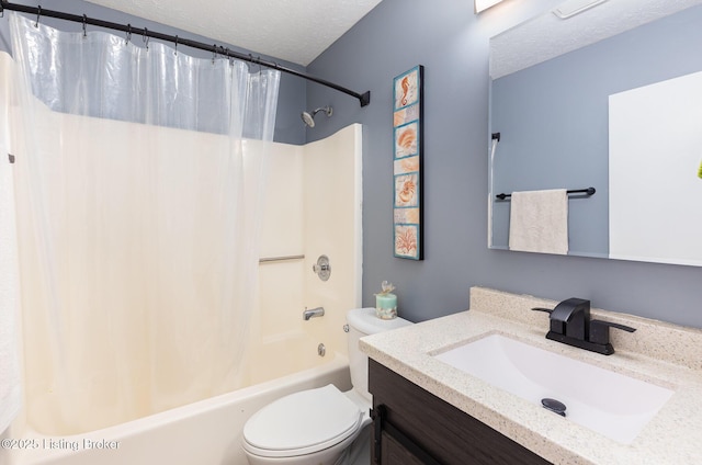bathroom with toilet, a textured ceiling, shower / tub combo, and vanity