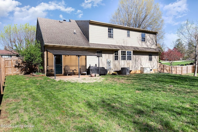 back of house with a patio area, a fenced backyard, central AC, and a lawn