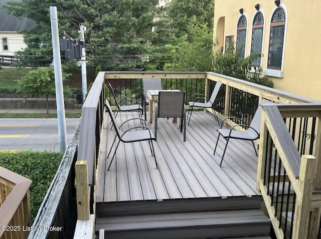 wooden deck with outdoor dining area