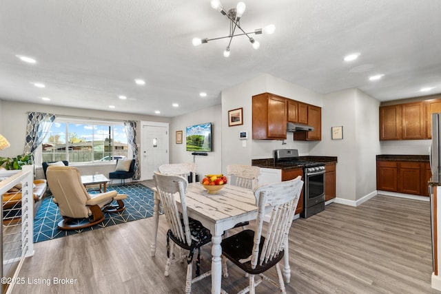 6201 Manse Dr, Louisville, KY 40258 - dining area with recessed lighting, light wood-style flooring, baseboards, and an inviting chandelier