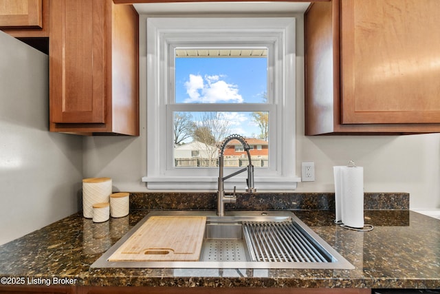 6201 Manse Dr, Louisville, KY 40258 - room details featuring dark stone counters, brown cabinets, and a sink