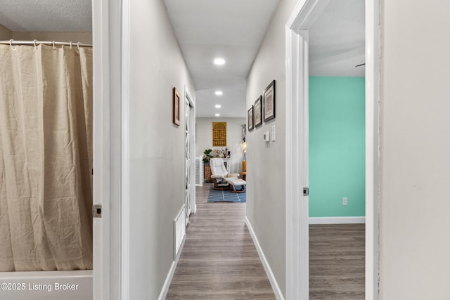 6201 Manse Dr, Louisville, KY 40258 - hall with wood finished floors, baseboards, and recessed lighting