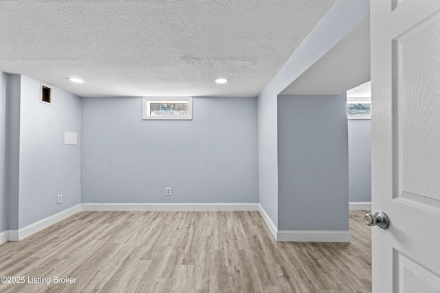 8006 Bramble Ln, Louisville, KY 40258 - below grade area with baseboards, wood finished floors, and a textured ceiling