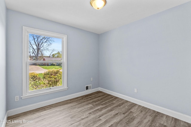 8006 Bramble Ln, Louisville, KY 40258 - spare room featuring visible vents, baseboards, and wood finished floors