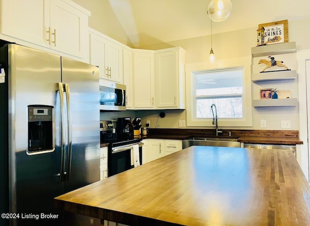 132 Cherry Ln, Leitchfield, KY 42754 - kitchen with butcher block countertops, vaulted ceiling, white cabinets, stainless steel appliances, and a sink