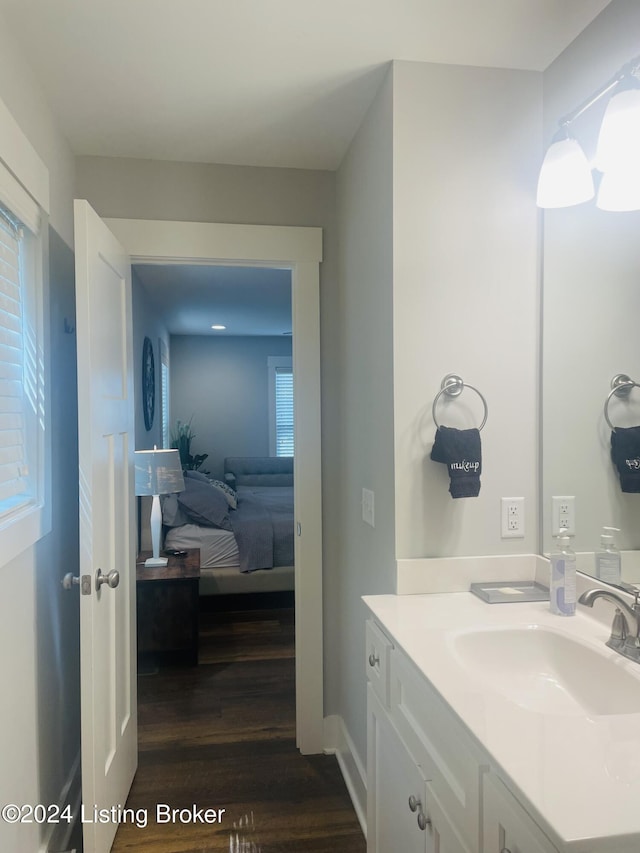 132 Cherry Ln, Leitchfield, KY 42754 - ensuite bathroom featuring baseboards, ensuite bath, wood finished floors, and vanity