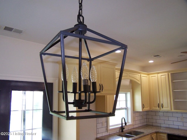 569 Deep Creek Dr, Shepherdsville, KY 40165 - kitchen view of a sink, decorative backsplash, open shelves, recessed lighting, and arched walkways