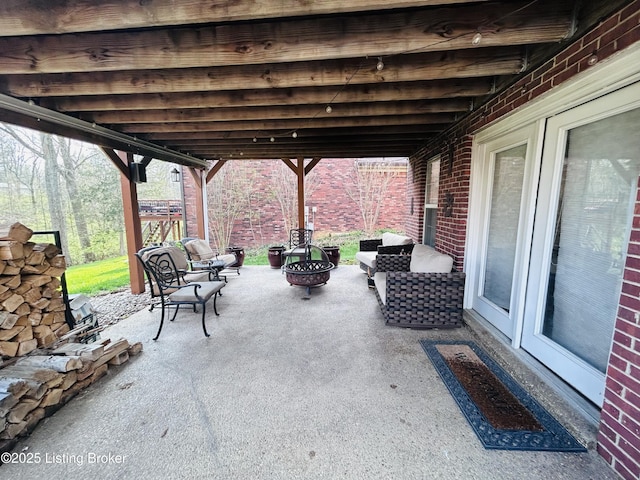 view of patio featuring an outdoor fire pit